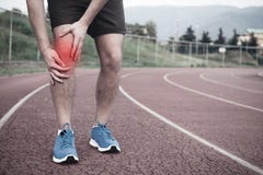 Biegacz z sporta urazem zdjęcia stock Biegacz z sporta urazem zdjęcia stock