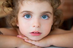 Big blue eyes toddler girl looking at camera stock photo Big blue eyes toddler girl looking at camera stock photo