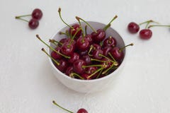 Big cherry in a plate on a white background royalty free stock photos Big cherry in a plate on a white background royalty free stock photos