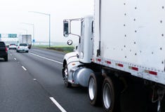 Big classic rig semi truck white trailer highway straight pipes stock image Big classic rig semi truck white trailer highway straight pipes stock image