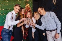 Big company celebrates a new year with glasses of champagne royalty free stock photo Big company celebrates a new year with glasses of champagne royalty free stock photo