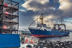 The big fishing ship at a pier stock photo The big fishing ship at a pier stock photo