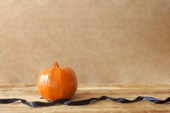 Big Halloween pumpkin decorated with black ribbon stock photography Big Halloween pumpkin decorated with black ribbon stock photography