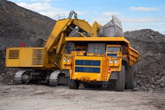 Big mining truck and excavator Royalty Free Stock Photo Big mining truck and excavator Royalty Free Stock Photo