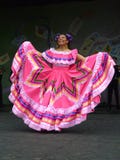 Big Pink Dress. Photo of mexican woman dancer at the cinco de mayo celebration on 5/2/10 at the washington monument grounds in washington dc. Cinco de mayo Big Pink Dress. Photo of mexican woman dancer at the cinco de mayo celebration on 5/2/10 at the washington monument grounds in washington dc. Cinco de mayo