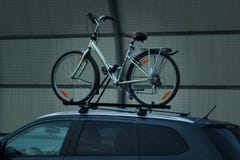 Bike transportation bike on the roof of a car royalty free stock photos Bike transportation bike on the roof of a car royalty free stock photos