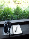 Binoculars and bird watching notes