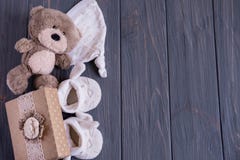 Birthday Baby Card, Newborn Card With Place For Inscription. Toy Bear, Booties On A Gray Wooden Background. This Is A Boy, This Is Royalty Free Stock Photography Birthday Baby Card, Newborn Card With Place For Inscription. Toy Bear, Booties On A Gray Wooden Background. This Is A Boy, This Is Royalty Free Stock Photography