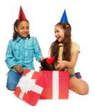 Birthday girl full of joy to open her present Stock Images Birthday girl full of joy to open her present Stock Images
