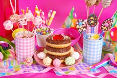 Birthday party table with flowers and sweets for kids