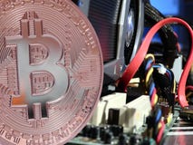 Bitcoin above motherboard royalty free stock image Bitcoin above motherboard royalty free stock image