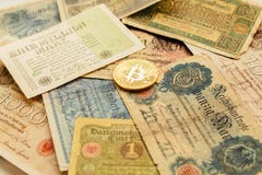 Bitcoin with old deutsch money. Inflation of paper money. Cryptocurrency concept background. Closeup with copy space. stock photos Bitcoin with old deutsch money. Inflation of paper money. Cryptocurrency concept background. Closeup with copy space. stock photos
