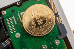 Bitcoin over fast computer hard disk drive stock photo Bitcoin over fast computer hard disk drive stock photo