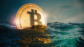 Bitcoin in the wild waves of the Sea. Bitcoin rising up or sinking down into the deep sea. 3D render illustration