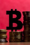A bitcoin sign made of blackboard and a stack of euro coins in a stock photos A bitcoin sign made of blackboard and a stack of euro coins in a stock photos