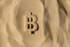 Bitcoin Symbol Under the Sand royalty free stock photo Bitcoin Symbol Under the Sand royalty free stock photo