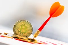 BitcoinBTC Gold and Darts arrow hitting in the target center of dartboard. virtual cryptocurrency concept. royalty free stock image BitcoinBTC Gold and Darts arrow hitting in the target center of dartboard. virtual cryptocurrency concept. royalty free stock image
