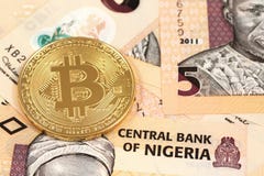 Bitcoins with Nigerian naira close up Stock Photos Bitcoins with Nigerian naira close up Stock Photos