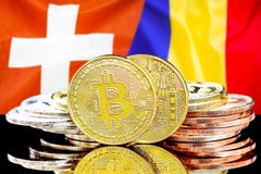Bitcoins op de vlagachtergrond van Zwitserland en van Moldavië stock foto Bitcoins op de vlagachtergrond van Zwitserland en van Moldavië stock foto