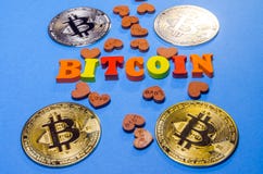 Bitcoins with wooden letters stock image Bitcoins with wooden letters stock image