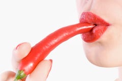Biting Red Hot Chili Pepper Royalty Free Stock Photo