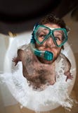 Bizarre man leaping out from toilet stock photo Bizarre man leaping out from toilet stock photo