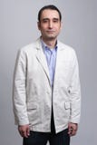 Biznesmen pozycja na popielatym tle obrazy stock Biznesmen pozycja na popielatym tle obrazy stock