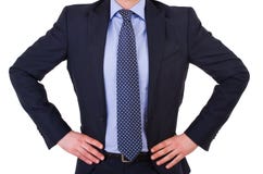Biznesmen z rękami na jego biodrach. Obraz Stock Biznesmen z rękami na jego biodrach. Obraz Stock