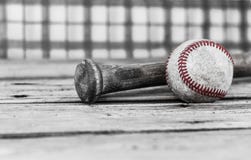 Black And White Image Of A Baseball And Bat On Wood Surface. Stock Image