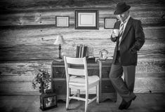 Black And White Photo Of Caucasian Man In A Suit Holding A Coffee Cup. Royalty Free Stock Photos