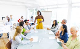 Black Business woman in conference with associates royalty free stock photo Black Business woman in conference with associates royalty free stock photo