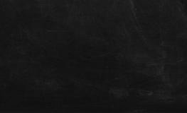 Black chalk board texture background.  Chalkboard, blackboard, school board  surface with scratches and chalk traces