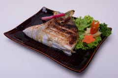 Black Cod Grilled ,Yellowtail Collar Grilled , Buri Kama , Traditional Japanese food isolated on white background stock photo Black Cod Grilled ,Yellowtail Collar Grilled , Buri Kama , Traditional Japanese food isolated on white background stock photo