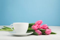 Black Coffee In White Cup With Pink Tulips On Light Stone Background Stock Photo Black Coffee In White Cup With Pink Tulips On Light Stone Background Stock Photo