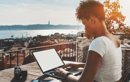 Black curly girl with laptop template and retro photo camera royalty free stock images Black curly girl with laptop template and retro photo camera royalty free stock images