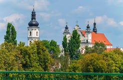 The black domes of the church hidden behind the trees shine under the rays of the summer sun royalty free stock photo The black domes of the church hidden behind the trees shine under the rays of the summer sun royalty free stock photo