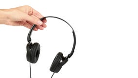Black headphones in hand isolated on white background. copy space, template Royalty Free Stock Image Black headphones in hand isolated on white background. copy space, template Royalty Free Stock Image
