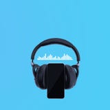 Black headphones with smart phone and music sound waves on a blue background stock image Black headphones with smart phone and music sound waves on a blue background stock image