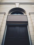 Black historical building Door with entrance singboard stock image Black historical building Door with entrance singboard stock image