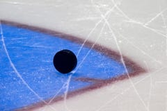 Black hockey puck on ice rink. Winter sport royalty free stock images Black hockey puck on ice rink. Winter sport royalty free stock images