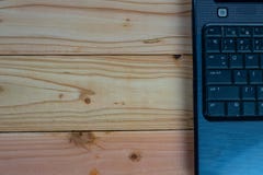 Black labtop on wood desk stock photography Black labtop on wood desk stock photography