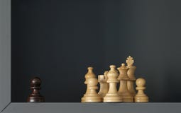 A black pawn is standing out of a group of white chess pieces stock image A black pawn is standing out of a group of white chess pieces stock image