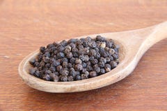 Black Pepper On A Wooden Table. Stock Photography