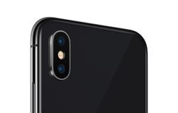 Black rotated smartphone similar to iPhone X back side close up with camera module isolated on white background royalty free stock photo Black rotated smartphone similar to iPhone X back side close up with camera module isolated on white background royalty free stock photo
