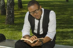 Black student reads a book stock photography Black student reads a book stock photography
