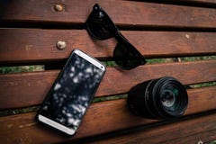 Black Wayfarer Sunglasses Near the Camera Lens Royalty Free Stock Image Black Wayfarer Sunglasses Near the Camera Lens Royalty Free Stock Image