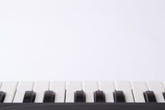 These are black and white keys of a children`s musical instrument - a synthesizer with a book for musicr stock images These are black and white keys of a children`s musical instrument - a synthesizer with a book for musicr stock images