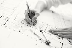 Black and white photo of architect working on house plan Stock Images Black and white photo of architect working on house plan Stock Images
