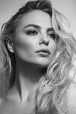 Black and white portrait of young beautiful woman with messy cur Stock Images Black and white portrait of young beautiful woman with messy cur Stock Images
