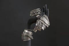 Black Woman`s Hand With Silver Jewelry. Oriental Bracelets On A Black Painted Hand Royalty Free Stock Images Black Woman`s Hand With Silver Jewelry. Oriental Bracelets On A Black Painted Hand Royalty Free Stock Images
